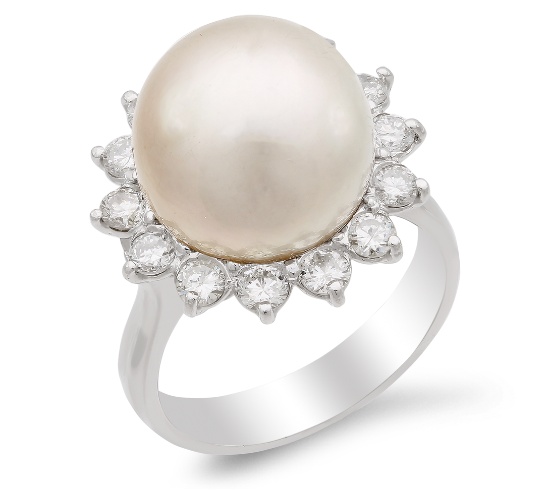 Dazzling dance of diamonds and pearls, set in a luxurious 18K gold band.