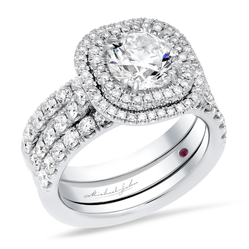 Three Piece Diamond halo engagement ring and matching bands with a total of carat round cut diamonds set in an 18K white gold halo and