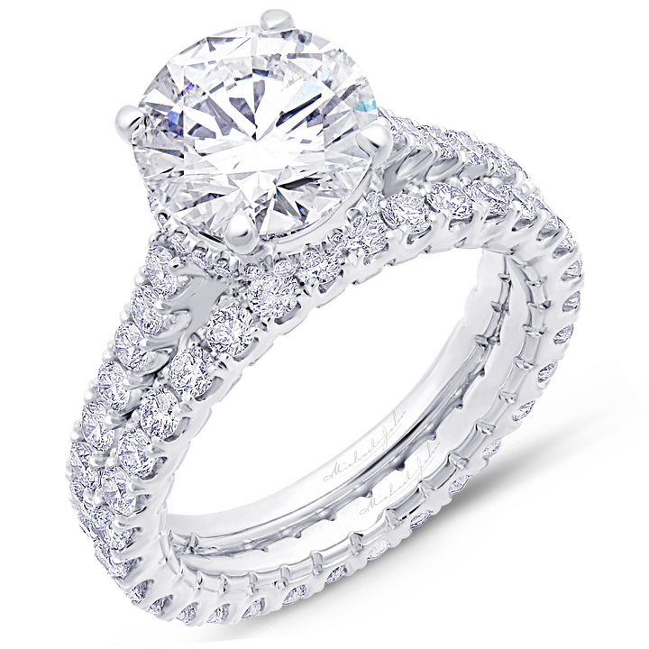 Hidden halo diamond engagement ring with matching diamond band, with a total of 1.70 carat round cut diamonds set on an 18K engagement rings