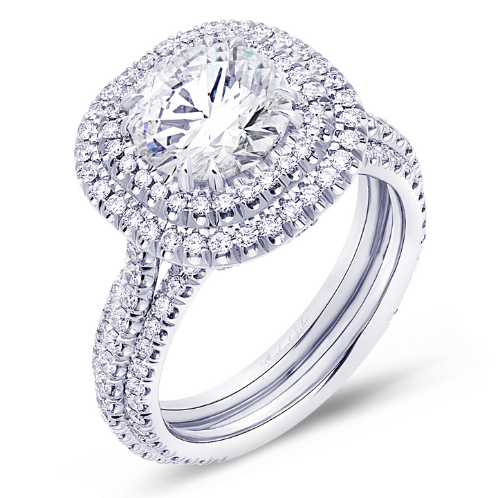 Diamond halo engagement ring handcrafted in 18K white gold setting with 0.70 carat total diamonds