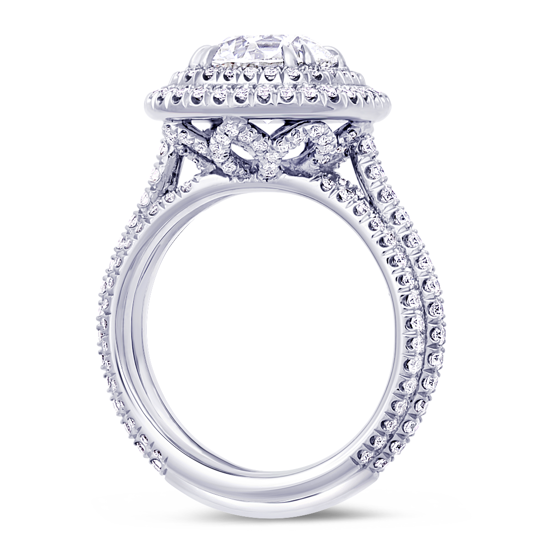 Diamond halo engagement ring handcrafted in 18K white gold setting with 0.70 carat total diamonds