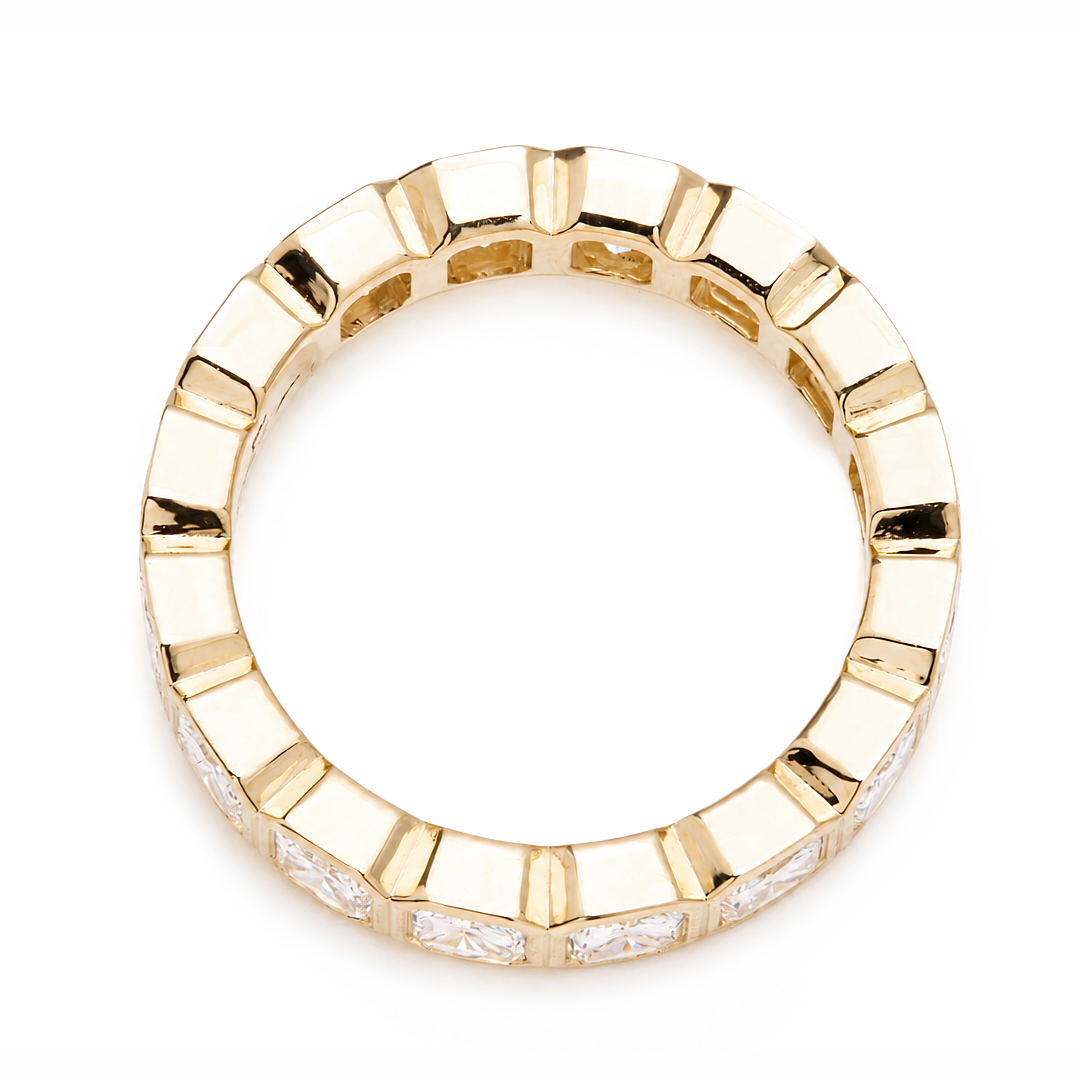 Cushion cut diamond eternity band set in an 18K gold band