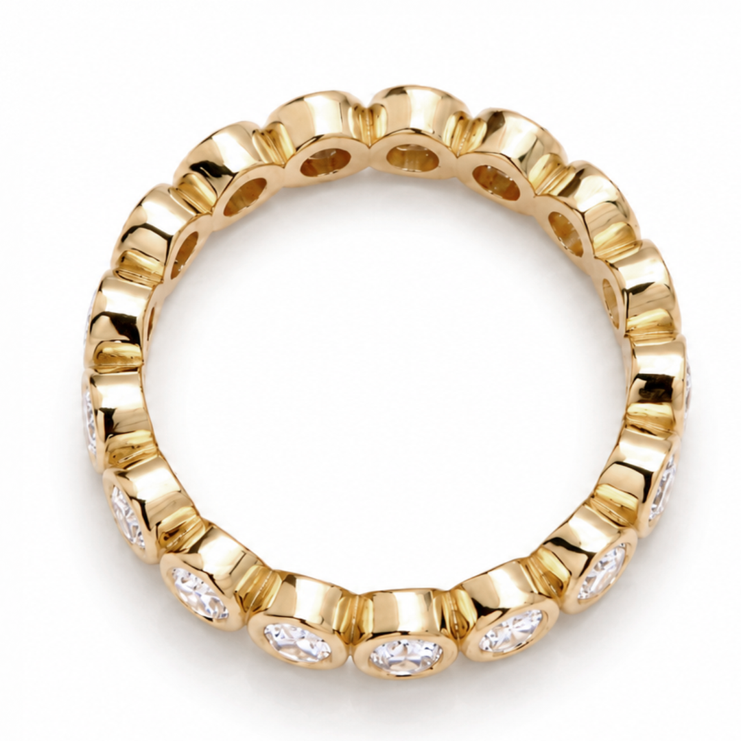 Oval cut diamond eternity band set in 18K gold band