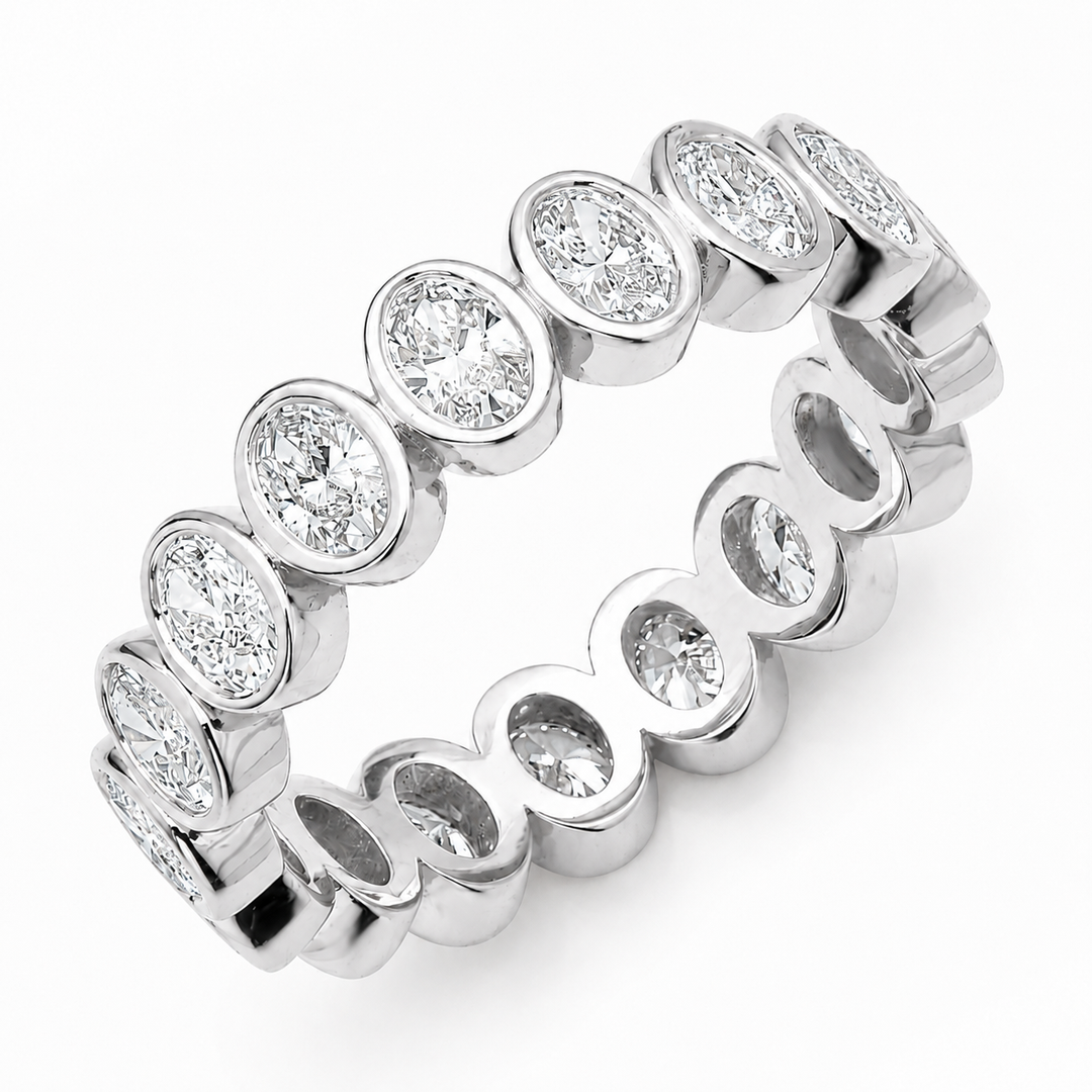 Oval cut diamond eternity band set in 18K gold band