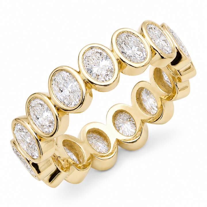 Oval cut diamond eternity band set in an 18K gold band