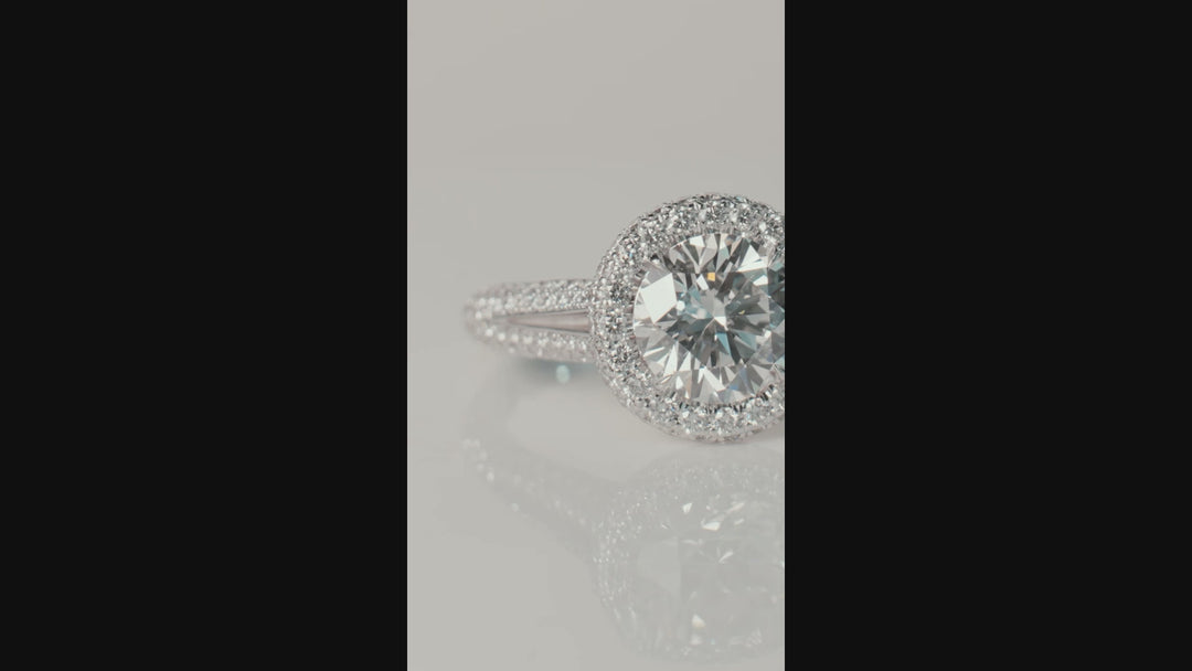 Unique pave style diamond engagement ring handcrafted in 18K white gold with a total of 1.20 carat round brilliant cut diamonds