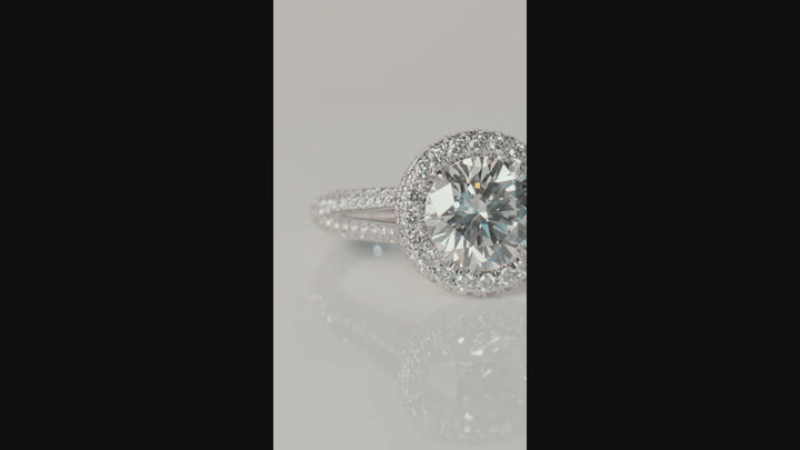 Unique pave style diamond engagement ring handcrafted in 18K white gold with a total of 1.20 carat round brilliant cut diamonds
