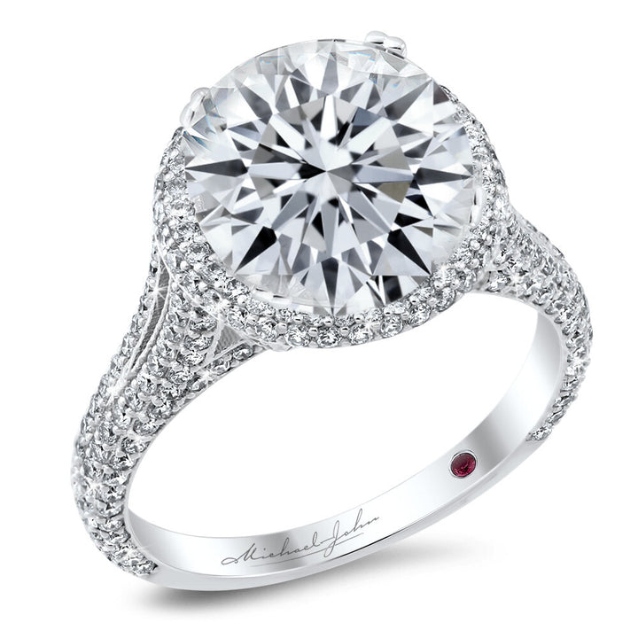 Pave diamond halo engagement ring with a total of 1.10 carat round cut diamonds on an 18K white gold setting