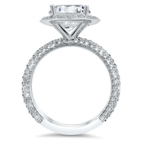 Diamond halo engagement ring and matching band with a total of 1.50 carat round cut diamonds set in an 18K white gold setting