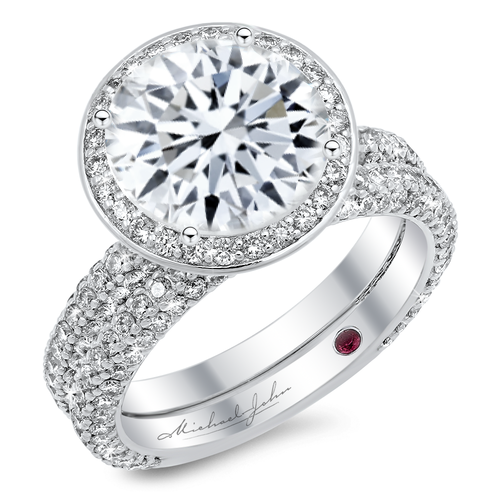 Diamond halo engagement ring and matching band with a total of 1.50 carat round cut diamonds set in an 18K white gold setting