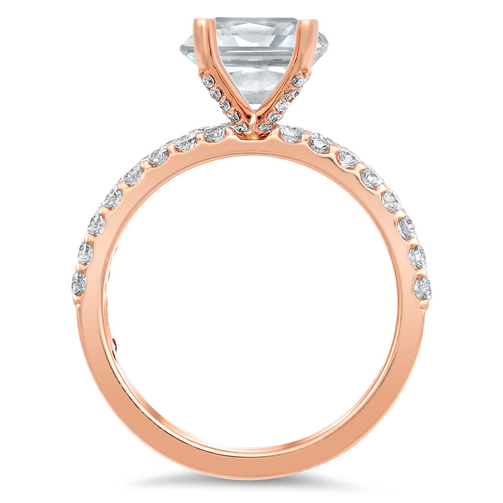 Diamond engagement ring and a matching diamond band with a total of 0.75 carat round cut diamonds set on an 18K rose gold prong style setting