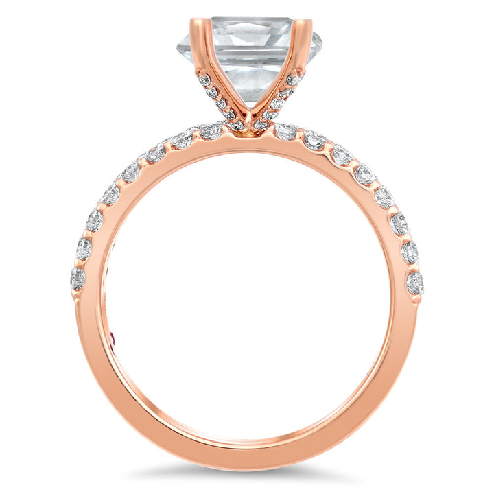 Diamond engagement ring and a matching diamond band with a total of 0.75 carat round cut diamonds set on an 18K rose gold prong style setting