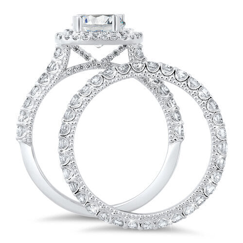 Double halo diamond engagement ring with a matching wedding band, with a total of 1.30 carat round cut diamonds set on an 18K white gold setting