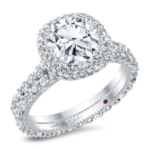 Double halo diamond engagement ring with a matching wedding band, with a total of 1.30 carat round cut diamonds set on an 18K white gold setting