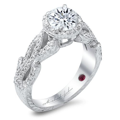 Vintage-inspired diamond engagement ring with a total of 0.50 carat round cut diamonds set on a floral 18K white gold shank