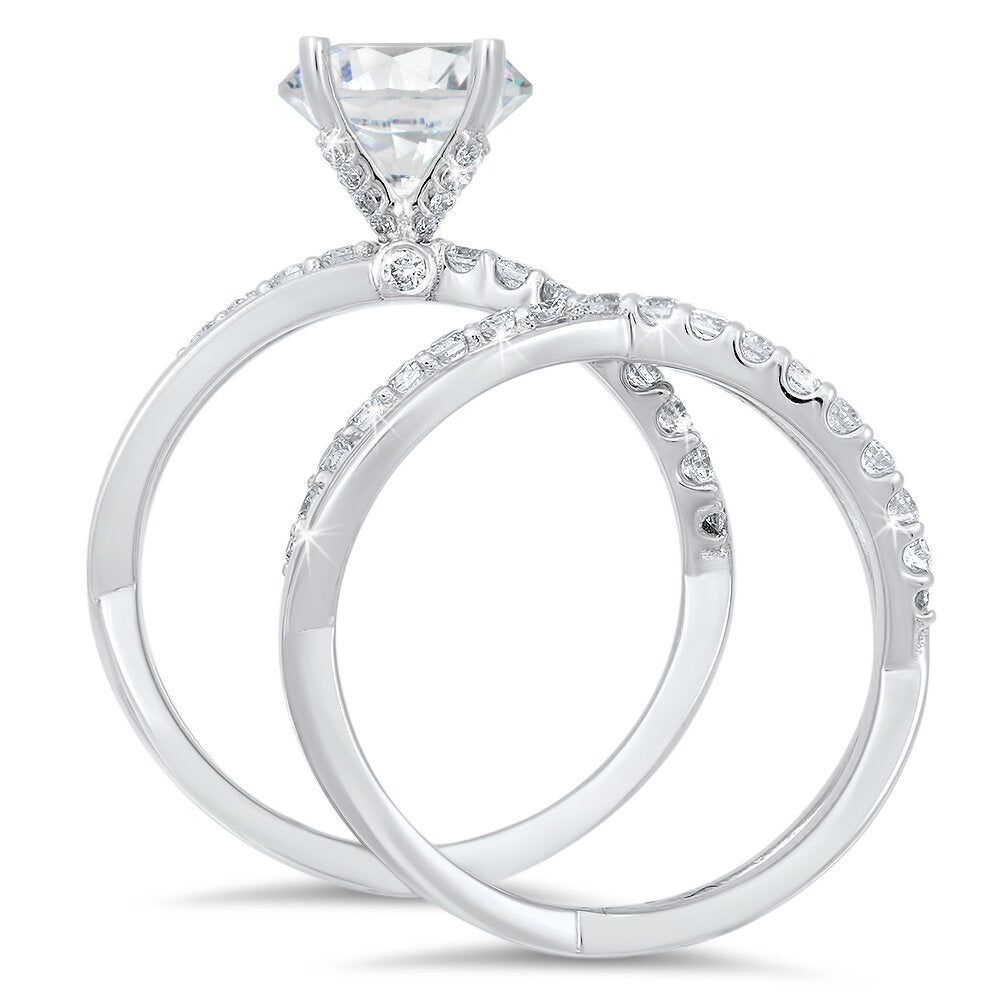 Unique diamond engagement ring with a matching wedding band with a total of 0.60 carat round cut diamonds on an 18K setting