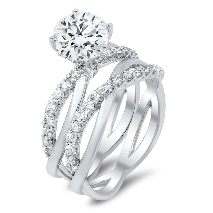 Unique diamond engagement ring with a matching wedding band with a total of 0.60 carat round cut diamonds on an 18K setting