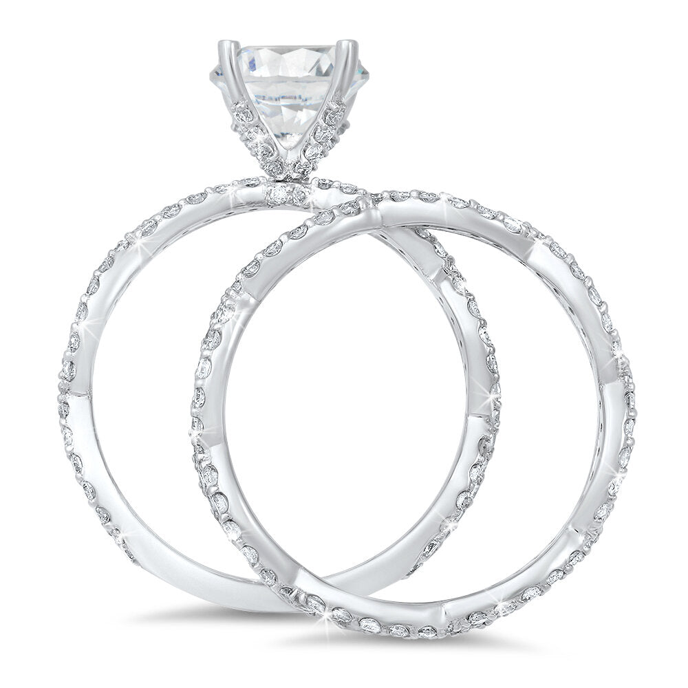 Weaving diamond engagement ring and a matching wedding band with a total of 1.10 carat round cut diamonds on an 18K white gold setting