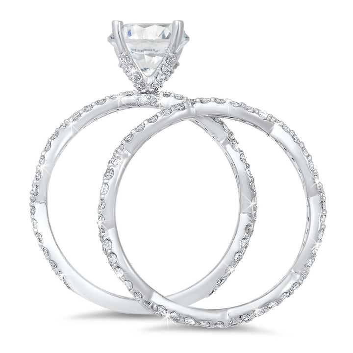 Weaving diamond engagement ring and a matching wedding band with a total of 1.10 carat round cut diamonds on an 18K white gold setting
