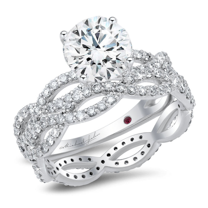 Weaving diamond engagement ring and a matching wedding band with a total of 1.10 carat round cut diamonds on an 18K white gold setting
