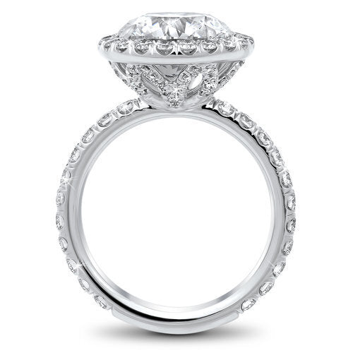 Diamond halo engagement ring with total of 1.10 carat round cut diamonds set in an 18K white gold setting