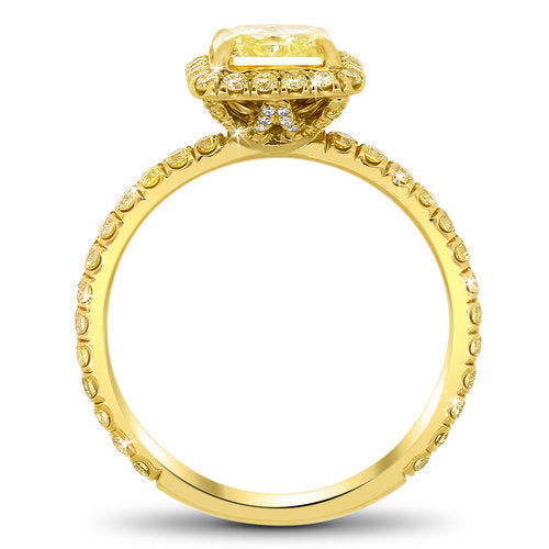 Yellow diamond halo engagement ring with total of 0.60 carat yellow diamonds set in an 18K yellow gold setting