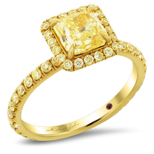Yellow diamond halo engagement ring with total of 0.60 carat yellow diamonds set in an 18K yellow gold setting