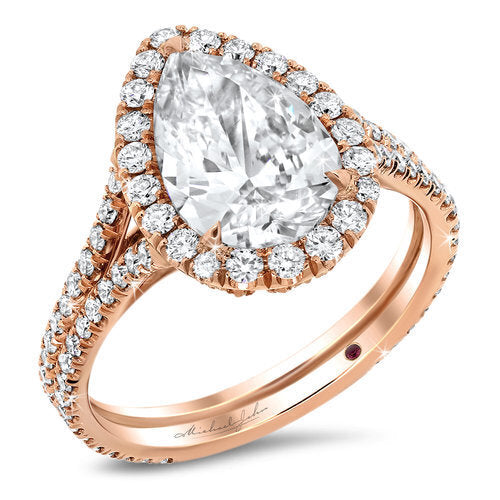Split shank diamond halo engagement ring with a total of 0.80 carat round cut diamonds set on an 18K rose gold setting