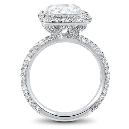 Diamond halo pave set engagement ring with a total of 1.20 carat round cut diamonds set in an 18K white gold setting