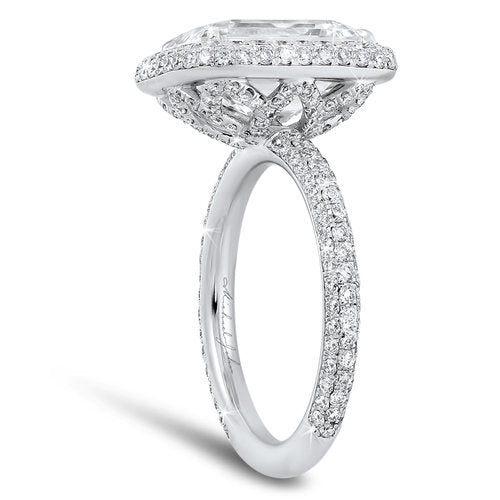 Diamond halo pave set engagement ring with a total of 1.20 carat round cut diamonds set in an 18K white gold setting