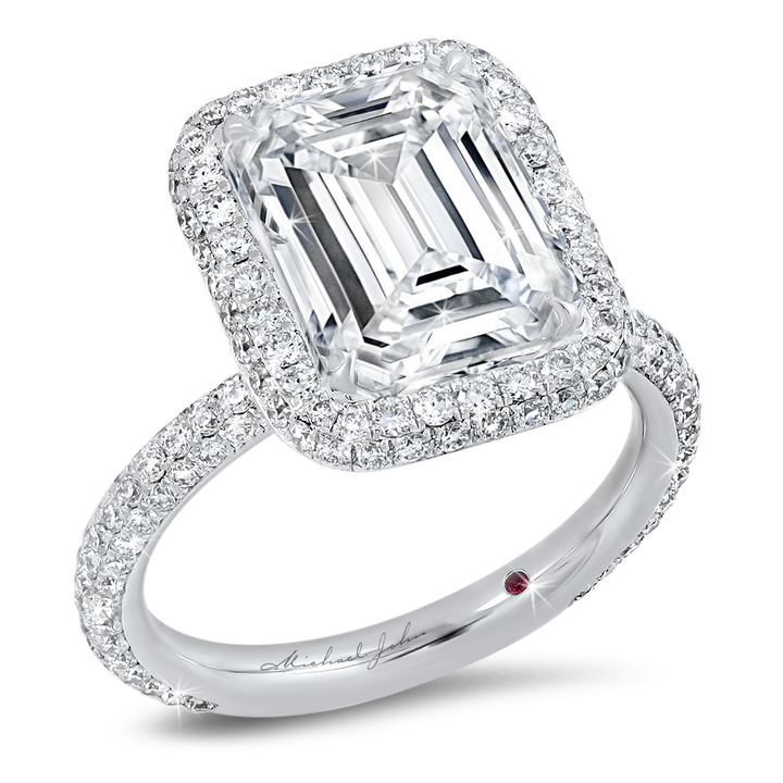 Diamond halo pave set engagement ring with a total of 1.20 carat round cut diamonds set in an 18K white gold setting